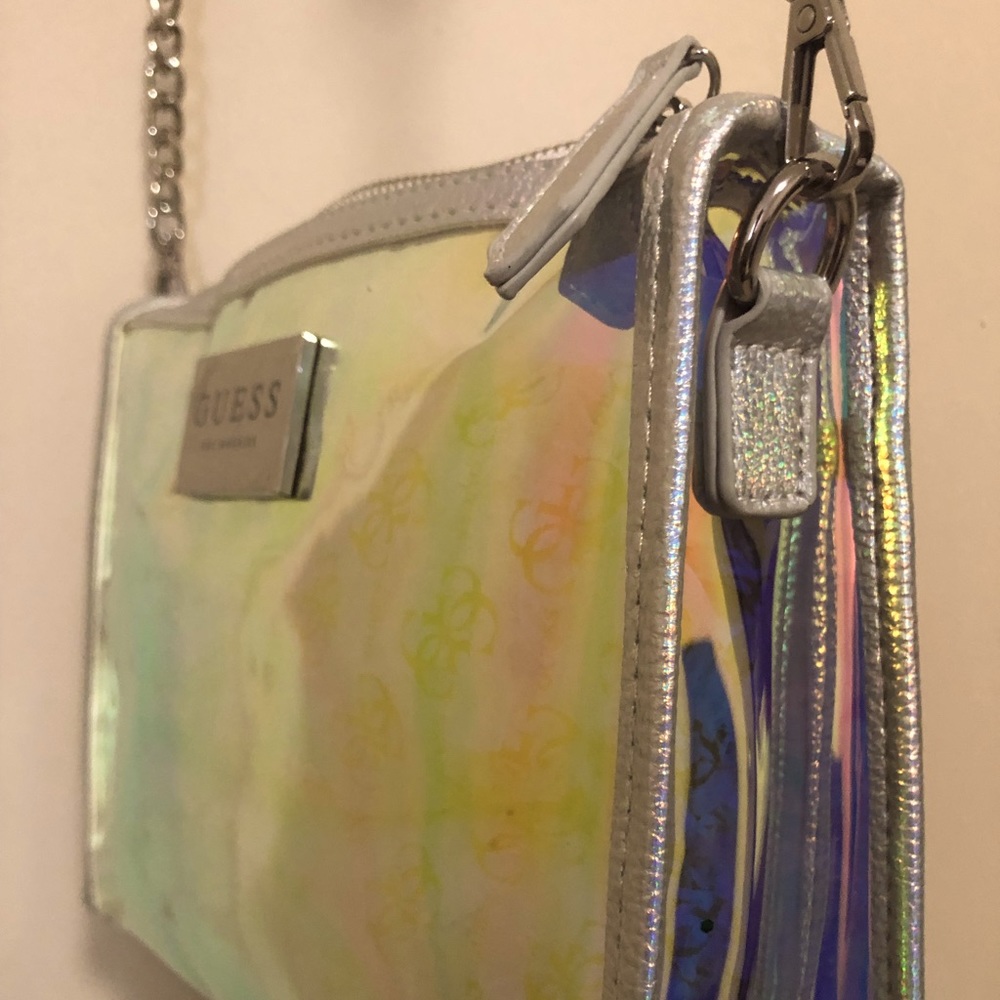 GUESS>> Silver metallic transparent crossbody bag.